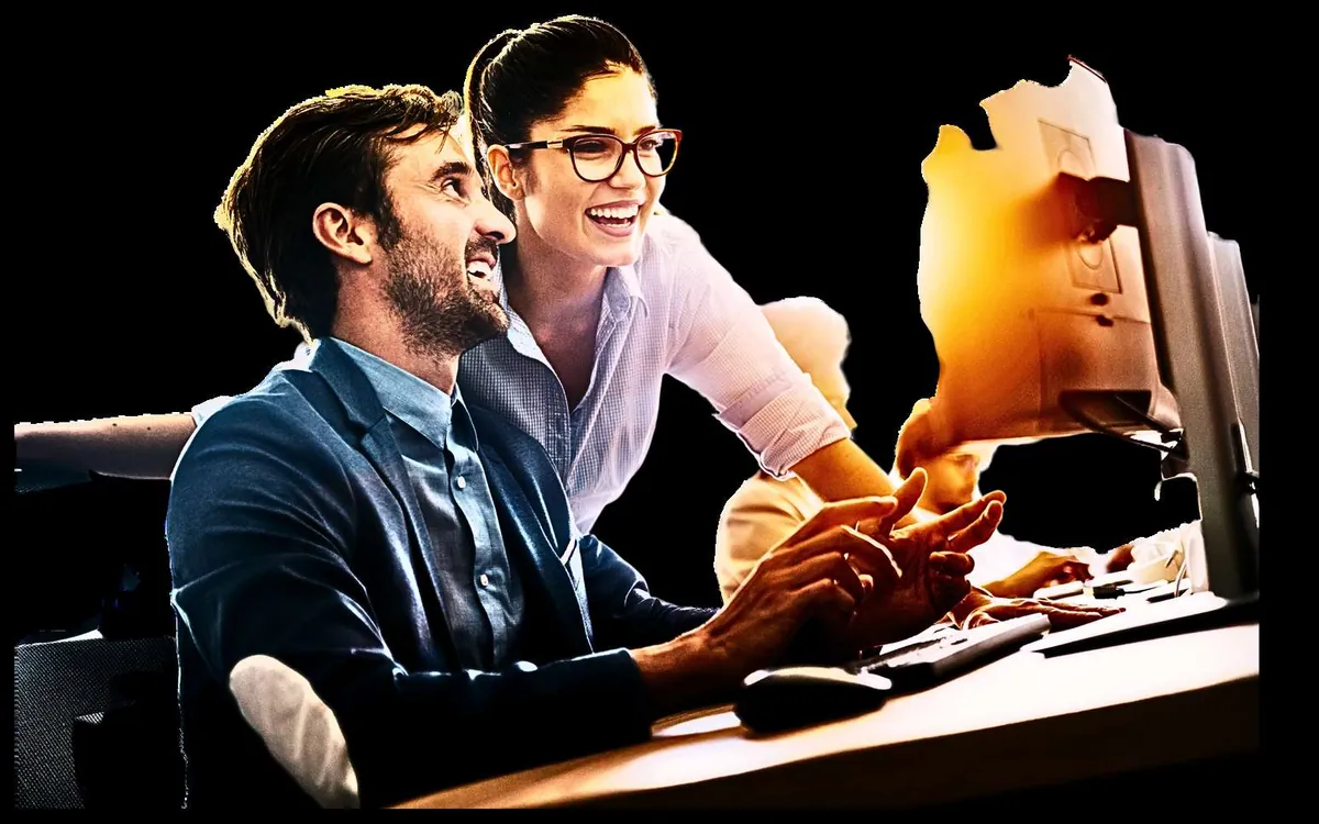Two Silicon IT Systems consultants working through a network design at a shared workstation